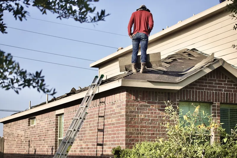 Professional roofer working on a residential roof in Nevada